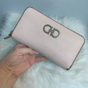 Authentic Ferragamo pale pink zippy wallet