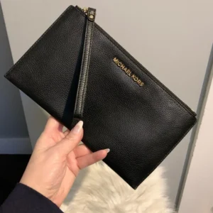 Authentic black buttery soft leather zippy wristlet with built in wallet