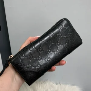 Authentic black leather Gucci zip around wallet - broken zipper
