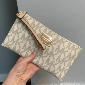Authentic Michael Kors cream signature wristlet zipper pouch